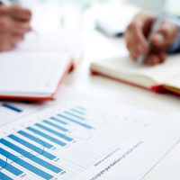 Financial graphs/charts on table